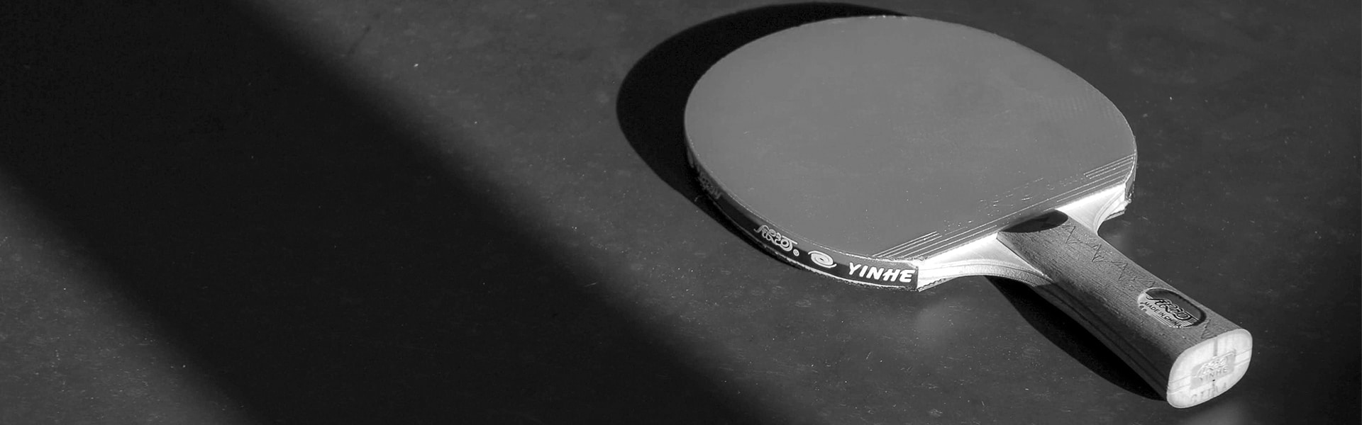 Ping Pong Paddle Against Black Background